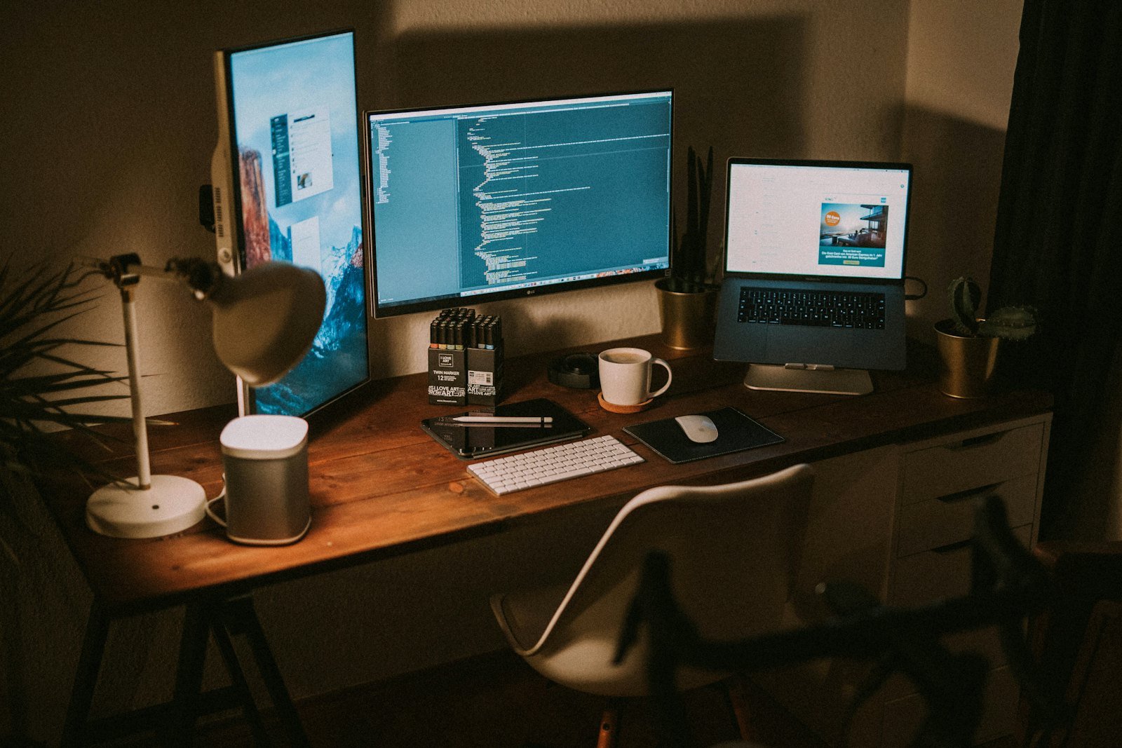 A Veinbit workstation — editor open, spec on the second screen